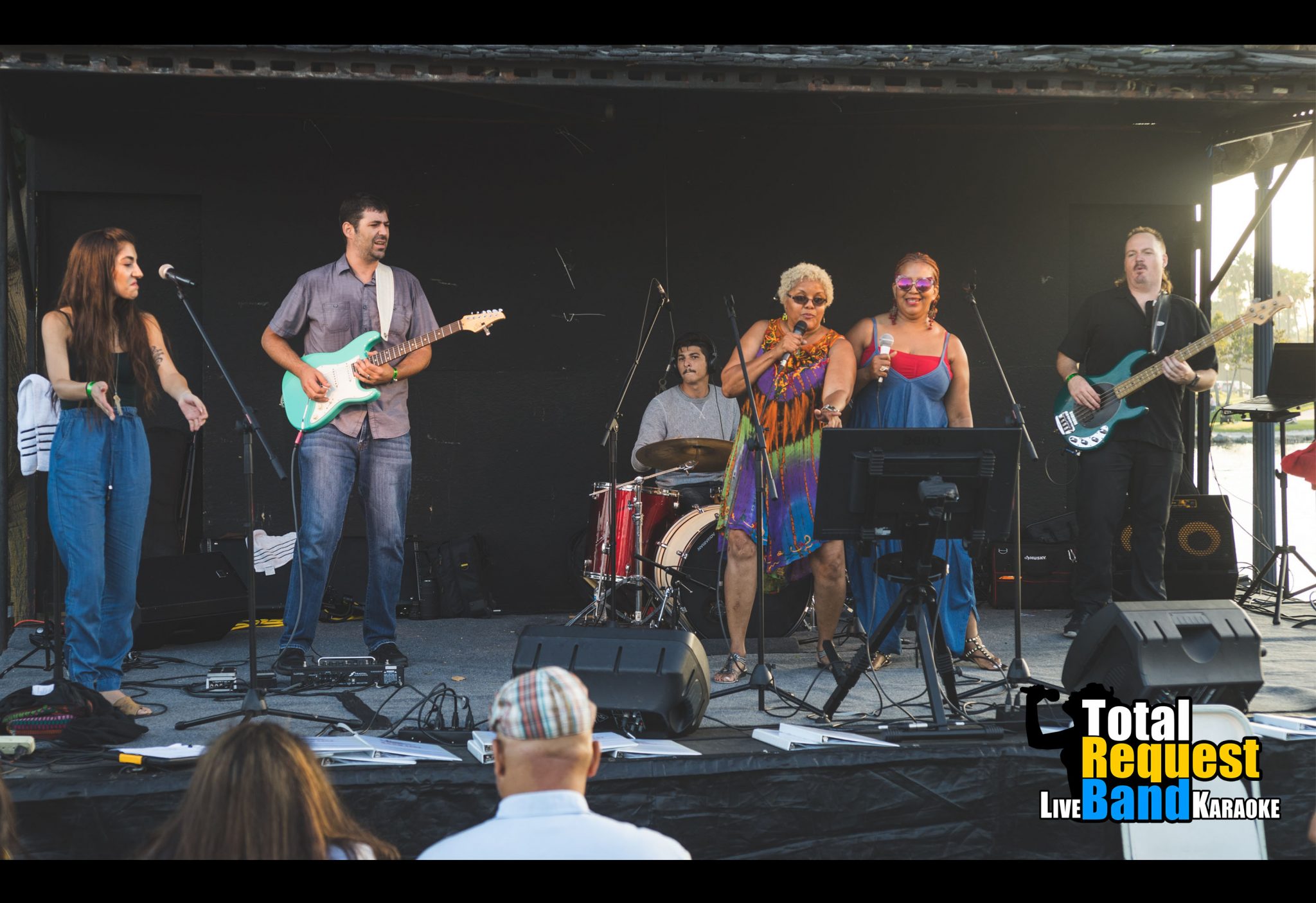 Energetic live band karaoke performance with full backing band