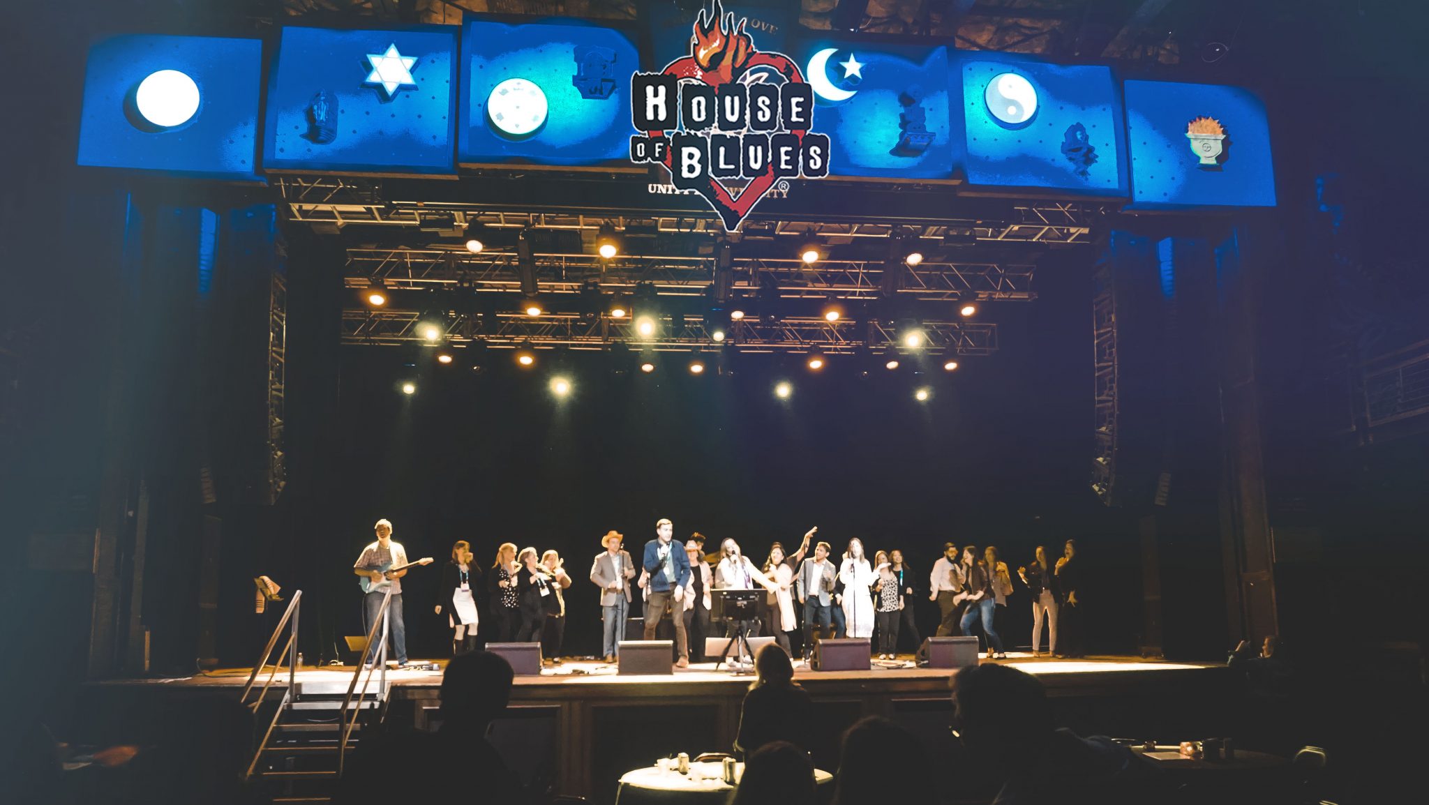 Singer belting out a song during live band karaoke at House of Blues
