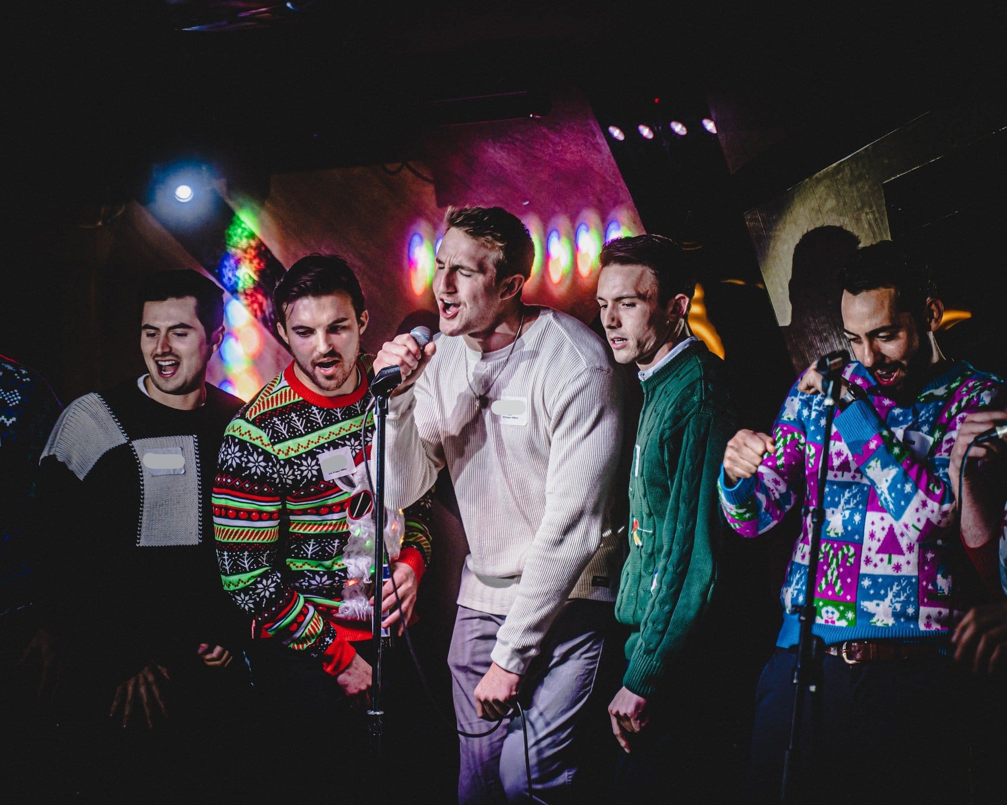 Guest singer taking the spotlight at a live band karaoke event